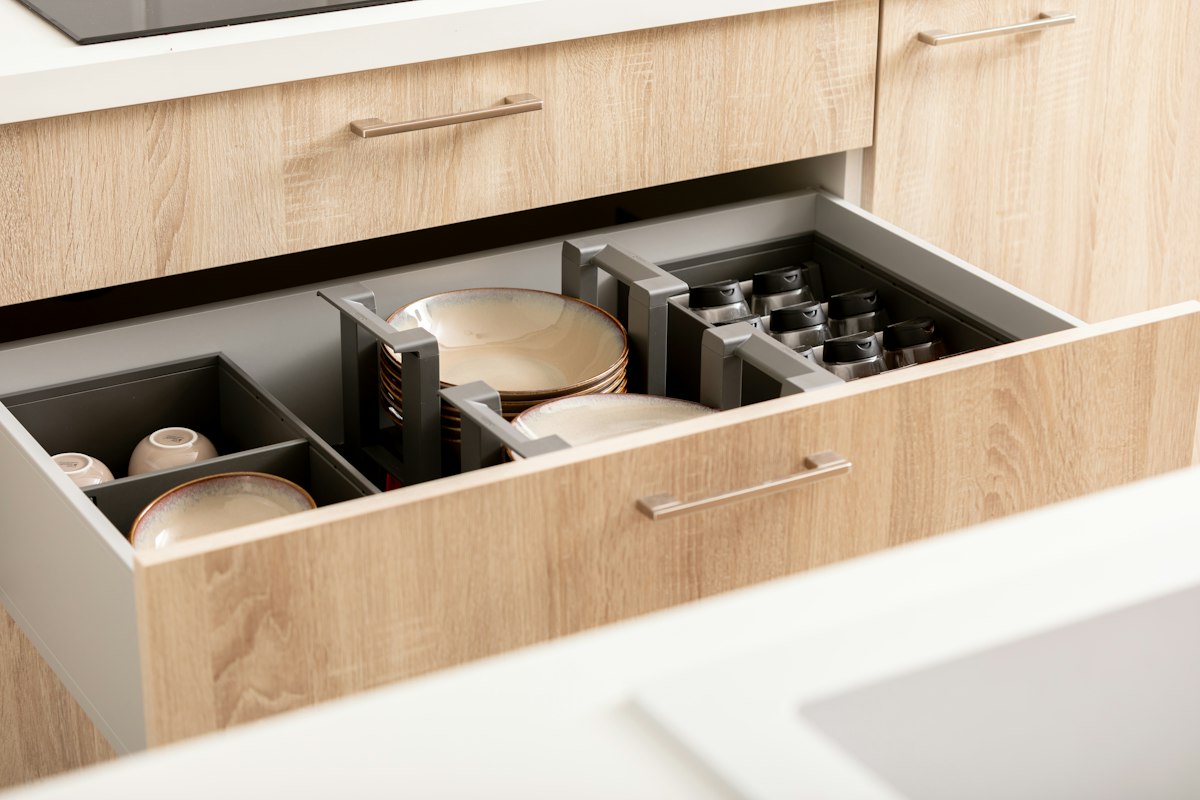 Oak-finish drawer with organiser inserts